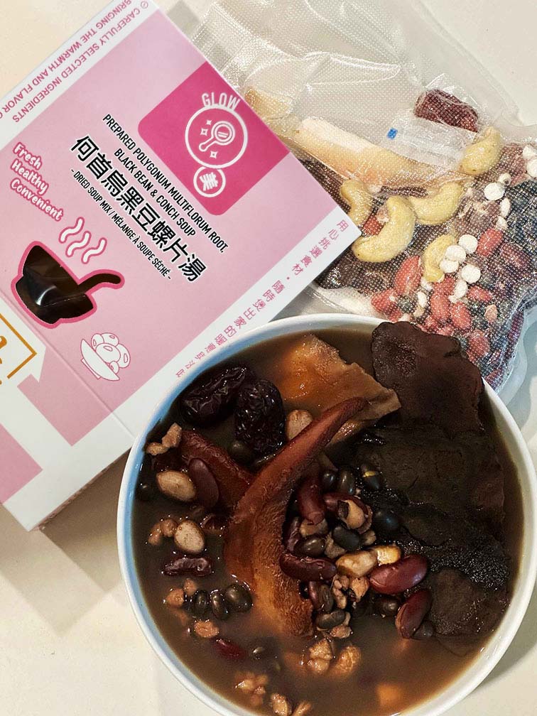 Hong Kong style Prepared Polygonum, Black Bean and Conch Soup – traditional Chinese herbal soup mix with vacuum-packed ingredients and cooked nourishing broth 港式何首烏黑豆螺片湯乾湯包成品展示｜真空包裝乾料（黑豆、螺片等）＋盒裝即煮湯料，搭配完成湯品湯碗，中式草本風味濃郁