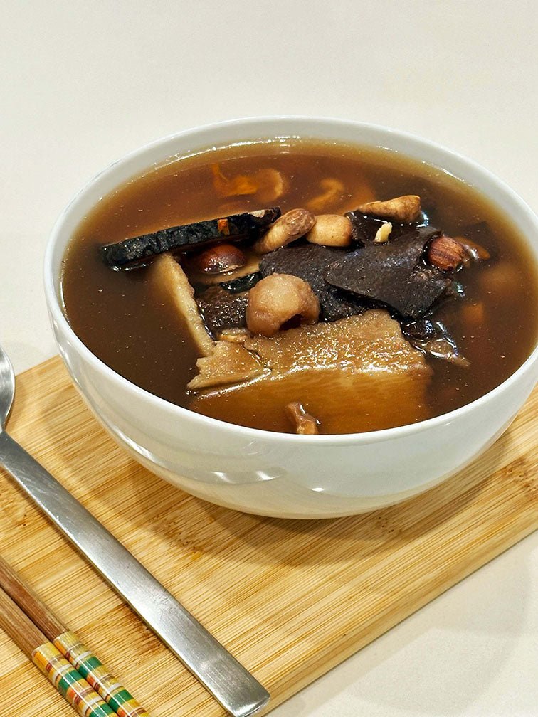 Close-up of prepared Calm Soup in a bowl - 陳皮茯神安逸湯 offering relaxing the mind benefits with natural ingredients. 一碗已煮好的陳皮茯神安逸湯特寫，提供安睡入眠功效，採用天然食材。